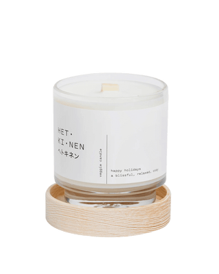 hetkinen co happy holidays scented candle from finland in minimalist glass jar with wood wick white label and wooden lid made with 100 percent essential oil gourmand home fragrance