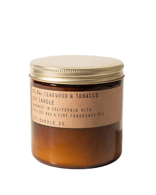 pf candle co teakwood tobacco soy candle in amber glass jar with kraft paper label and gold lid 70 hour burn time clean burn woody leathery citrus home fragrance boyfriend inspired best selling scent large 12.5oz size