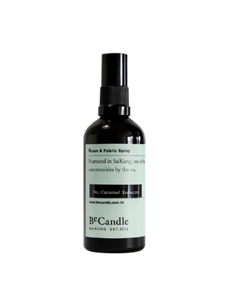 BeCandle Caramel Tobacco room and fabric spray in a black glass bottle with cap and light blue label, a woody and aromatic home fragrance.