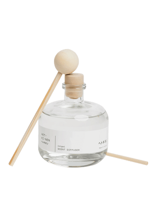 Hetkinen Co Ikigai reed diffuser from Finland in a minimalist 100ml glass bottle with 100% essential oil, offering a woody home fragrance.