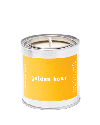 Golden Hour scented candle by Malathebrand in a tin vessel with 25-hour burn time, woody home fragrance.