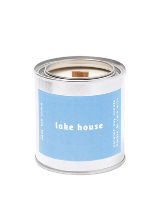 malathebrand lake house coconut soy wax wood wick scented candle in tin with pastel blue label 25 hour burn time fresh woody home fragrance