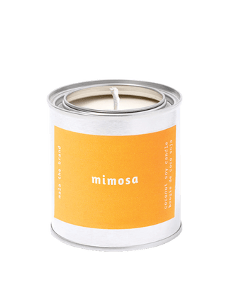 malathebrand mimosa coconut soy wax scented candle in tin with light orange label 25 hour burn time citrus fruity home fragrance