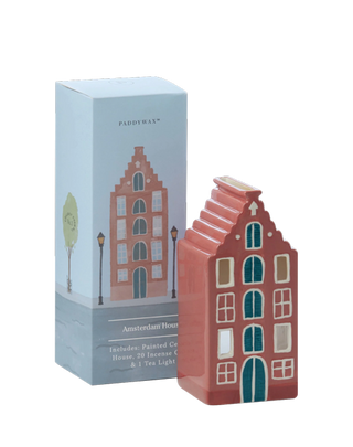 Paddywax Amsterdam House ceramic incense holder in terracotta red with teal windows and white details, paired with blue illustrated box, includes 20 incense cones and a tealight candle, European-inspired home fragrance décor.