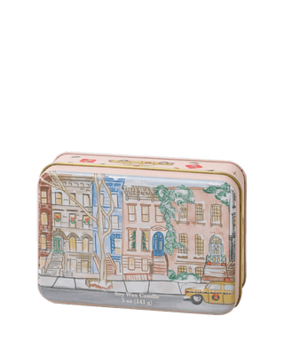 Paddywax Holiday 5 oz 2 wick candle tin Tangerine and Clove with illustrated winter city street and taxi design, cozy citrus and spice fragrance in reusable festive tin, perfect for Christmas gifting and home décor.