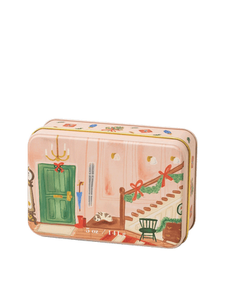 Paddywax Holiday 5 oz 2 wick candle tin Wassail featuring cozy illustrated hallway scene with green door and garland staircase, spiced wine and citrus fragrance in reusable festive tin, perfect for Christmas gifting or holiday décor.
