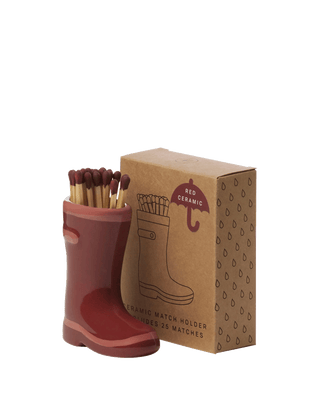 Paddywax red ceramic Wellington boot match holder with 25 matches, glossy rain wellington boot design with kraft box packaging, reusable match striker and candle accessory gift for cozy homes.