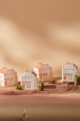 Paddywax Santa Fe Adobe incense houses styled in desert sand scene with cactus and succulents, terracotta ceramic design evoking southwestern architecture, warm earthy home décor and gift idea.