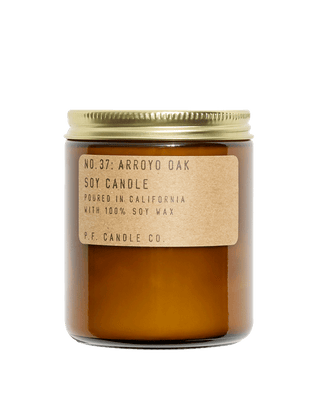 pf candle co arroyo oak soy scented candle from classic collection in amber jar with kraft paper label and gold lid 50 hour burn time clean burn smoky forest hike home fragrance 