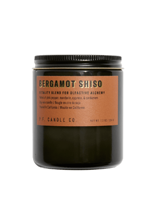 pf candle co bergamot shiso soy scented candle from alchemy collection in black jar with burnt orange label and black lid 50 hour burn time clean burn botanical floral citrus fresh uplifting home fragrance