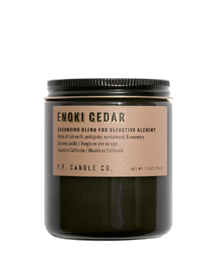 pf candle co enoki cedar soy scented candle from alchemy collection in black jar with light brown label and black lid 50 hour burn time clean burn earthy home fragrance grounding rainy forest scent