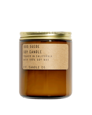 pf candle co iris suede soy scented candle from classic collection in amber jar with kraft paper label and gold lid 50 hour burn time clean burn smoky woody home fragrance grounding and cozy