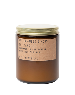 pf candle co amber and moss soy candle in amber glass jar with kraft paper label and gold lid 50 hour burn time clean burn fresh earthy home fragrance inspired by sunlit mountainsides bestselling scent