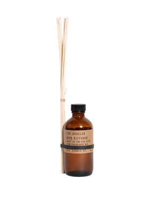 pf candle co los angeles reed diffuser in amber glass bottle with black cap and kraft paper label 3 5oz woody aromatic home fragrance relaxing LA city vibe inspired scent