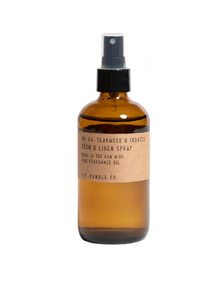 pf candle co teakwood tobacco room and linen spray in amber glass bottle with transparent cap and kraft paper label 7oz woody floral home fragrance best selling popular scent